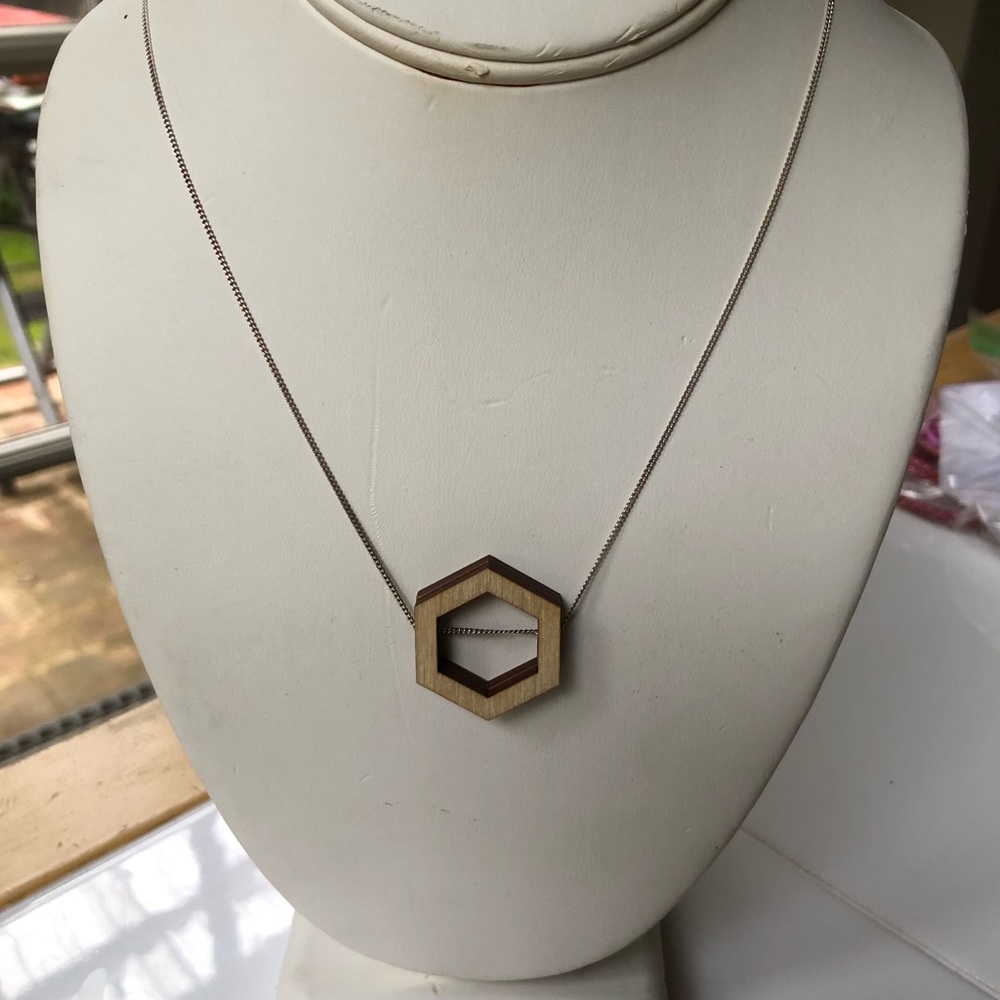 NWT Laser-cut wood hexagon necklace on 16” silver chain.